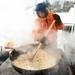 Israel Hurtado stirrers a pot of kettle corn at Henne Field during Saline's Winterfest Saturday Jan. 26th.Courtney Sacco I AnnArbor.com 